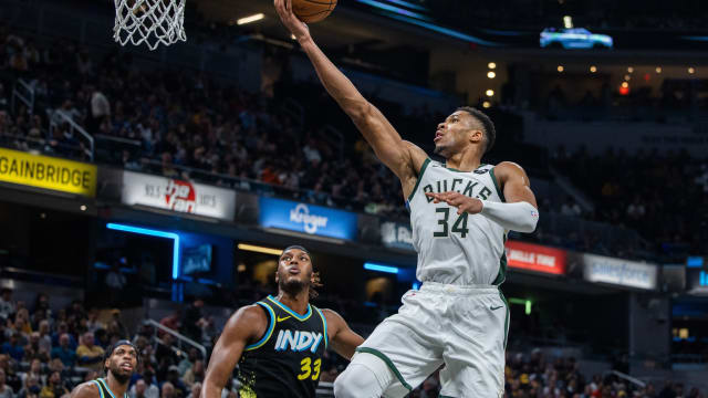 Milwaukee Bucks forward Giannis Antetokounmpo (34) shoots the ball while Indiana Pacers center Myles Turner (33) 